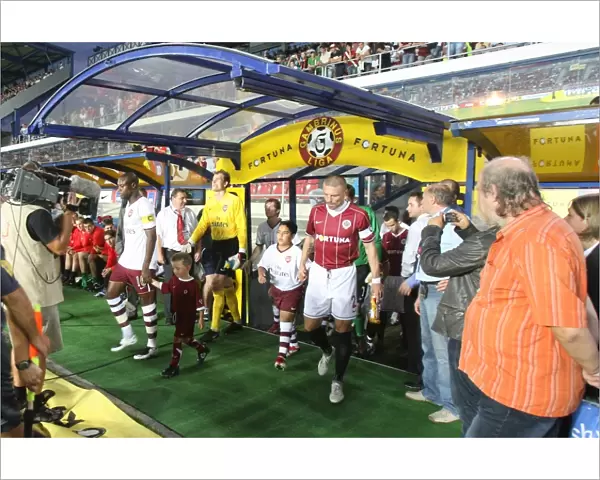 William Gallas and Tomas Repka lead out the teams before the match
