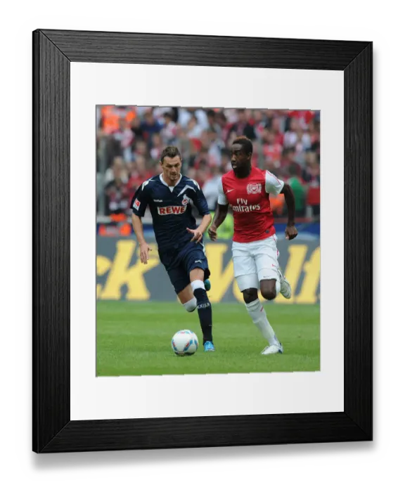 Framed Print : Clash of Forces: Novakovic vs. Djourou in Cologne's Battle with Arsenal Framed Print : Clash of Forces: Novakovic vs. Djourou in Cologne's Battle with Arsenal