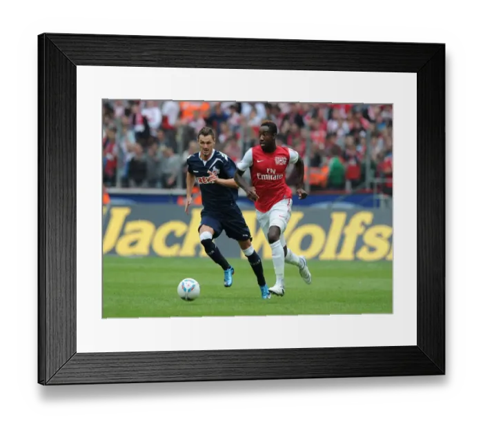 Framed Print : Clash of Champions: Novakovic vs. Djourou in Cologne's Battle with Arsenal Framed Print : Clash of Champions: Novakovic vs. Djourou in Cologne's Battle with Arsenal