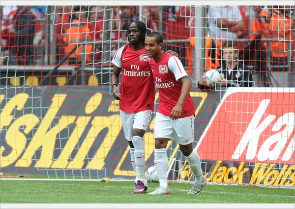 Gervinho and Theo Walcott Celebrate Arsenal's Goals in Cologne Friendly