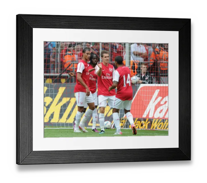 Framed Print : Gervinho's Brace: Arsenal Celebrates Double Delight Against Cologne