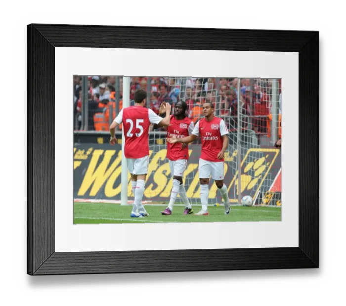 Framed Print : Gervinho, Jenkinson, and Walcott Celebrate Arsenal's Goals Against Cologne Framed Print : Gervinho, Jenkinson, and Walcott Celebrate Arsenal's Goals Against Cologne