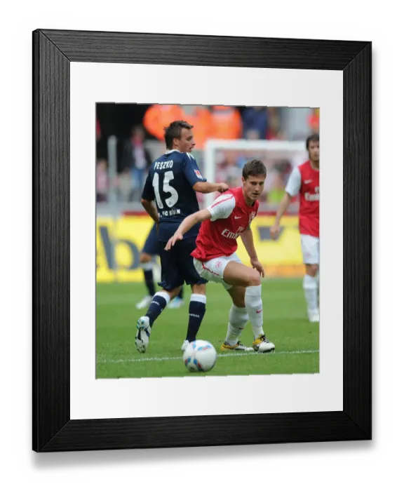 Framed Print : Conor Henderson vs. Slawomir Peszko: A Clash in Pre-Season Friendly between Cologne and Arsenal Framed Print : Conor Henderson vs. Slawomir Peszko: A Clash in Pre-Season Friendly between Cologne and Arsenal