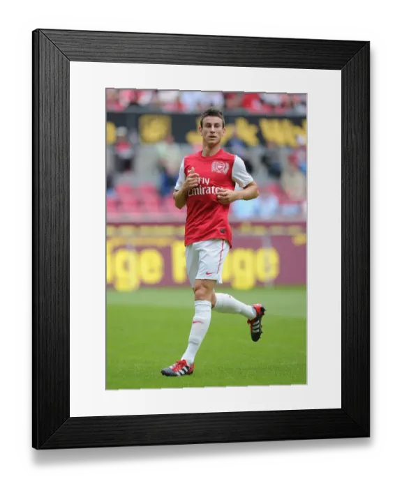 Framed Print : Laurent Koscielny Leads Arsenal in Pre-Season Friendly Against Cologne, 2011