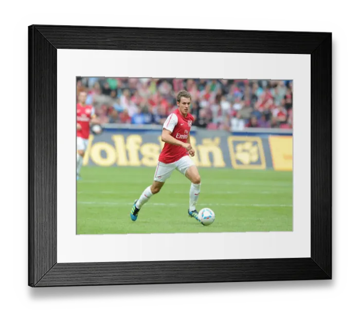 Framed Print : Aaron Ramsey in Action: Cologne vs Arsenal Pre-Season Friendly, 2011