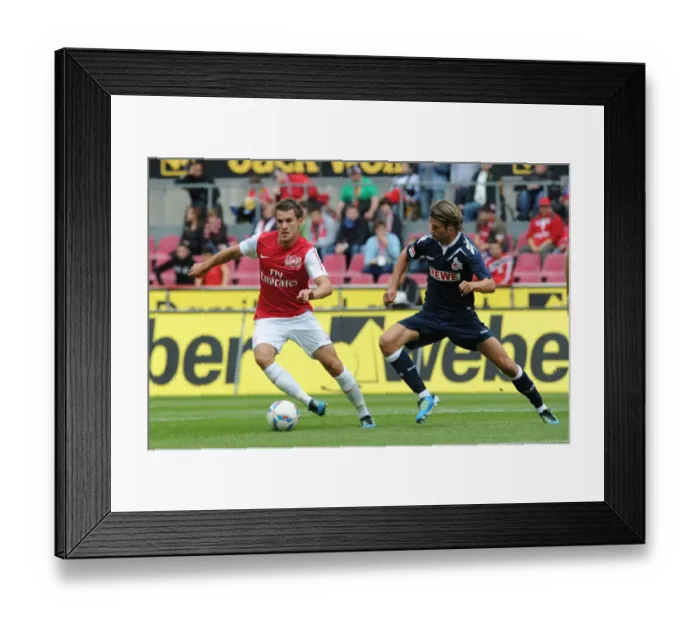 Framed Print : Ramsey Takes on Lanig: Cologne vs Arsenal Pre-Season Clash