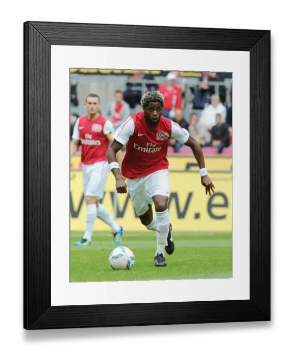 Framed Print : Alex Song in Action: Arsenal's Pre-Season Friendly vs Cologne Framed Print : Alex Song in Action: Arsenal's Pre-Season Friendly vs Cologne