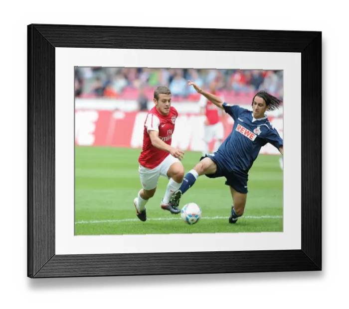 Framed Print : Jack Wilshere vs Pedro Geromel: Clash in Pre-Season Friendly between Cologne and Arsenal