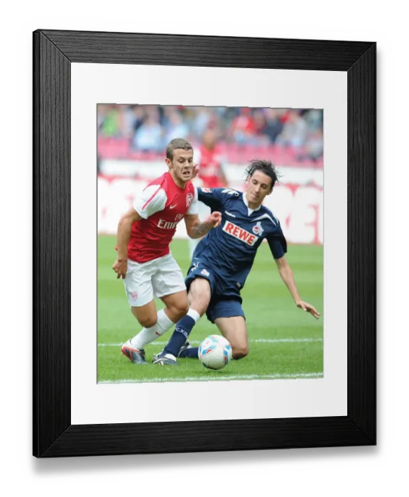 Framed Print : Jack Wilshere Takes on Pedro Geromel: Cologne vs. Arsenal Pre-Season Clash Framed Print : Jack Wilshere Takes on Pedro Geromel: Cologne vs. Arsenal Pre-Season Clash