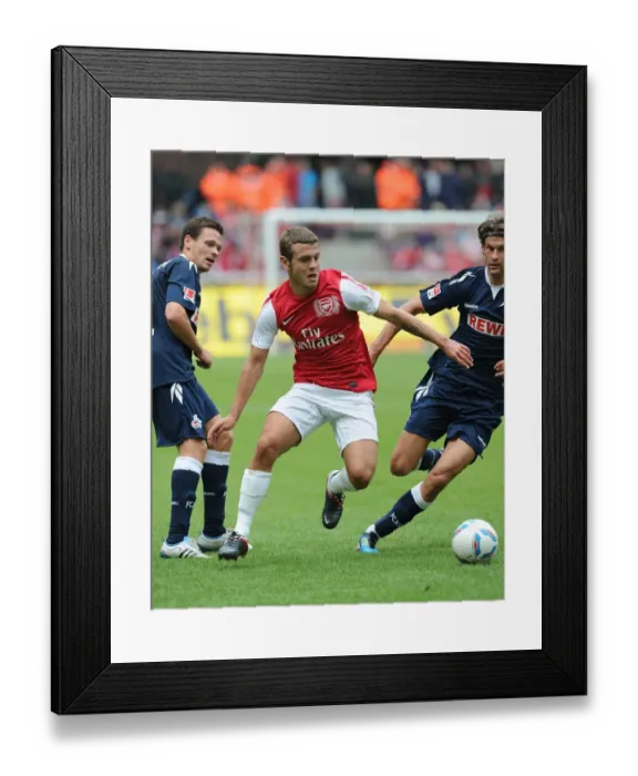 Framed Print : Jack Wilshere Faces Off Against Martin Lanig in Cologne Friendly