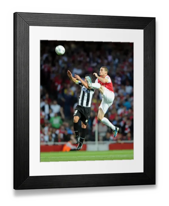 Framed Print : Thomas Vermaelen's Header: Arsenal Takes 1-0 Lead Over Udinese in UEFA Champions League Framed Print : Thomas Vermaelen's Header: Arsenal Takes 1-0 Lead Over Udinese in UEFA Champions League