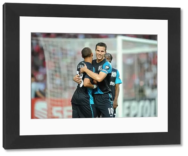 Van Persie and Gibbs: Arsenal's Unstoppable Duo Celebrate Goal in Benfica Pre-Season Clash, 2011