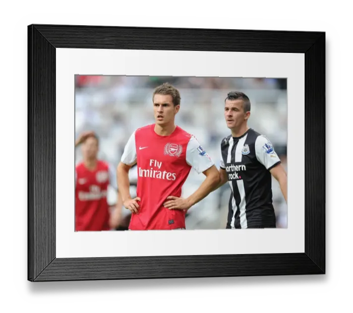 Framed Print : Aaron Ramsey vs Joey Barton: Intense Battle in Newcastle United vs Arsenal (2011-12)