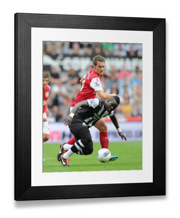 Framed Print : Intense Rivalry: Ramsey vs. Tiote Battle at St. James Park (2011-12) Framed Print : Intense Rivalry: Ramsey vs. Tiote Battle at St. James Park (2011-12)