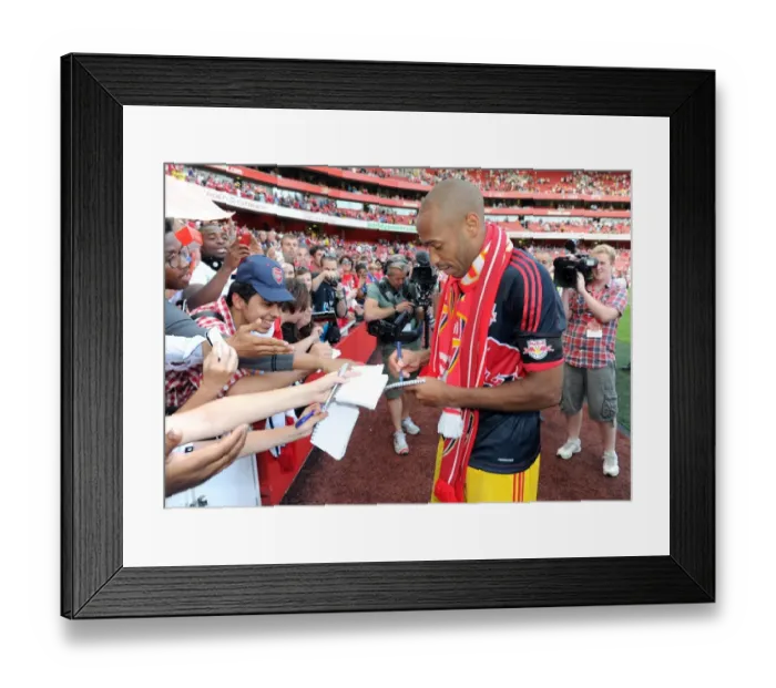 Framed Print : Thierry Henry (Red Bulls) signs autographs for the fans at the end of the match