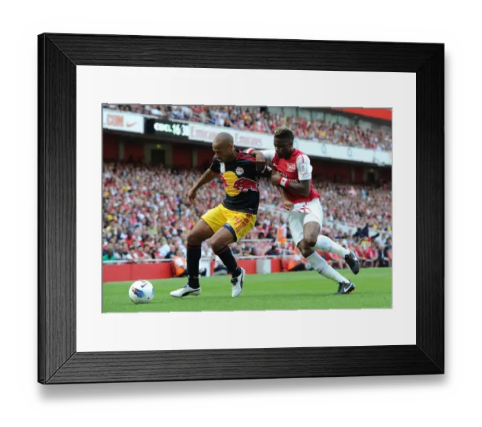 Framed Print : Thierry Henry (Red Bulls) and Alex Song (Arsenal). Arsenal 1: 1 New York Red Bulls Framed Print : Thierry Henry (Red Bulls) and Alex Song (Arsenal). Arsenal 1: 1 New York Red Bulls