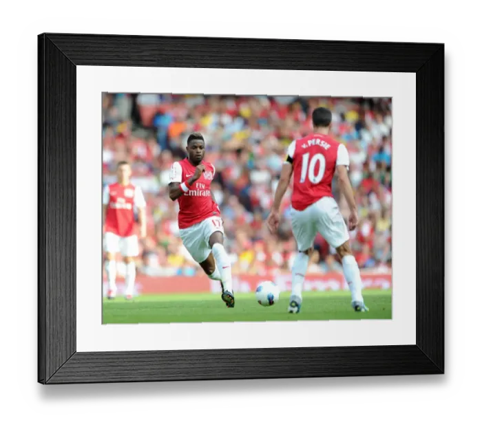 Framed Print : Alex Song passes to Robin van Persie (Arsenal). Arsenal 1: 1 New York Red Bulls