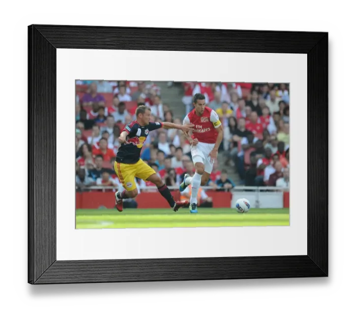 Framed Print : Arsenal's Robin van Persie Faces Off Against Teemu Tainio of New York Red Bulls during the 2011-12 Emirates Cup