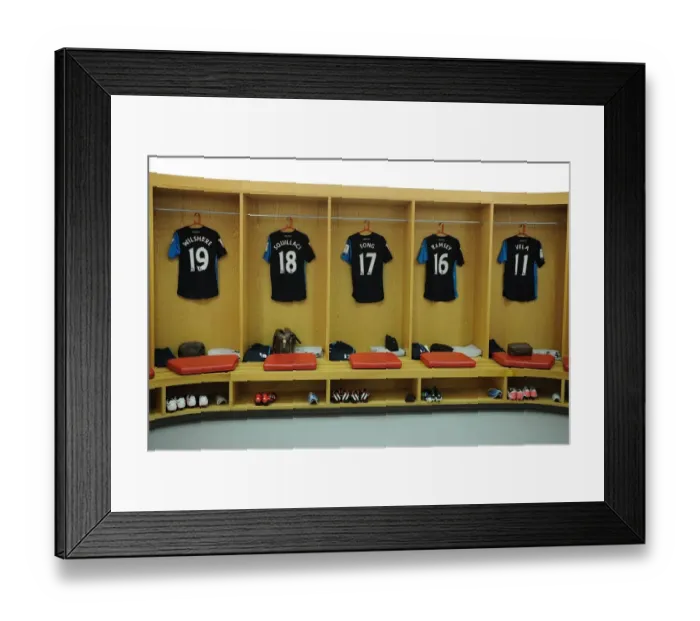 Framed Print : Behind the Scenes: Arsenal Football Club Changing Room before the Emiras Cup Match against Boca Juniors
