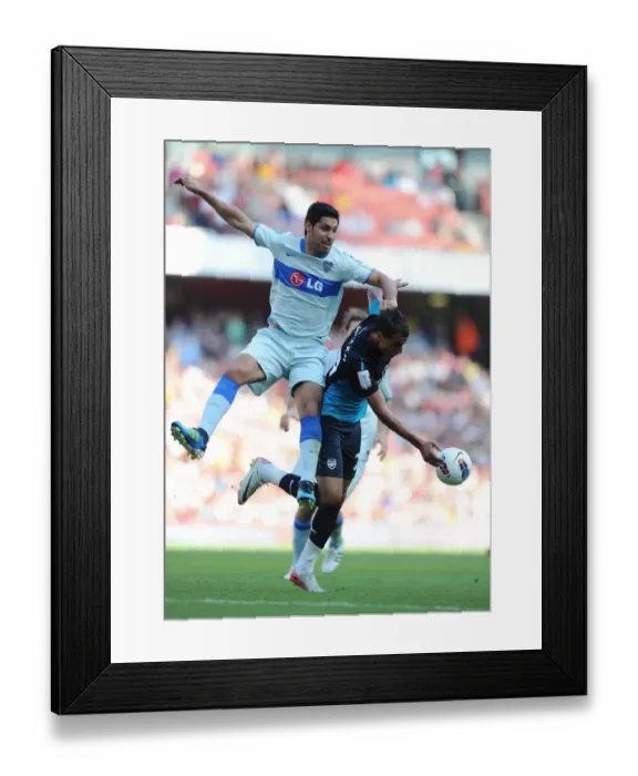 Framed Print : Chamakh vs. Insaurralde: Aerial Battle at the Emirates Cup