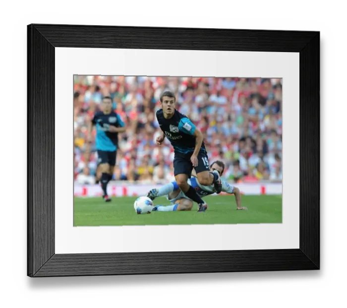 Framed Print : Arsenal's Jack Wilshere vs. Leandro Somoza: A Clash of Midfield Titans at the Emirates Cup, 2011 Framed Print : Arsenal's Jack Wilshere vs. Leandro Somoza: A Clash of Midfield Titans at the Emirates Cup, 2011