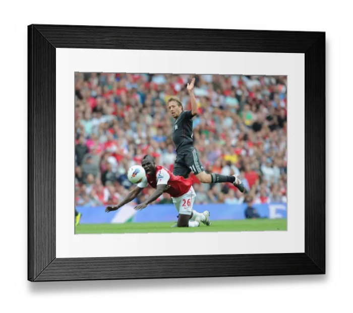 Framed Print : Arsenal vs. Liverpool: Frimpong Fouls Lucas in Intense Premier League Clash