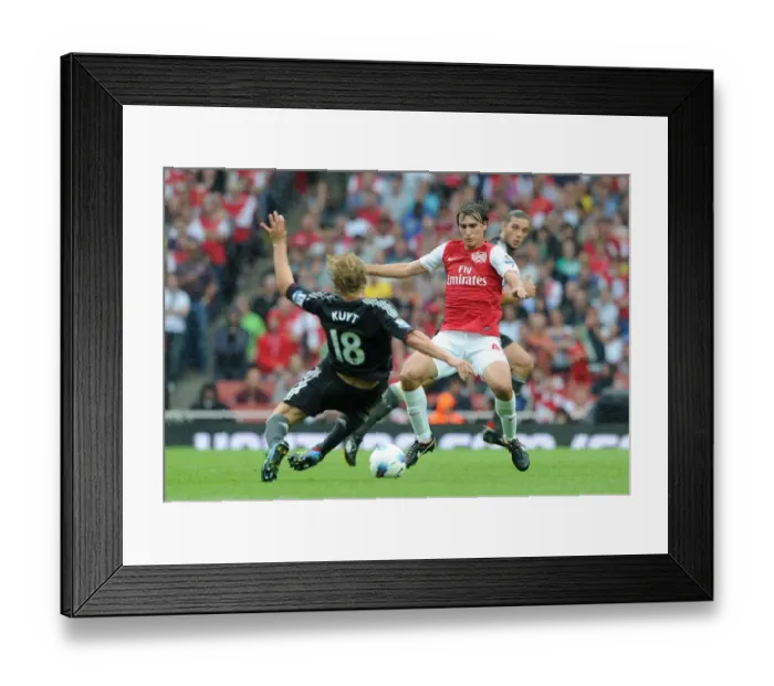 Framed Print : Ignasi Miquel (Arsenal) Dirk Kuyt (Liverpool). Arsenal 0: 2 Liverpool. Barclays Premier League Framed Print : Ignasi Miquel (Arsenal) Dirk Kuyt (Liverpool). Arsenal 0: 2 Liverpool. Barclays Premier League