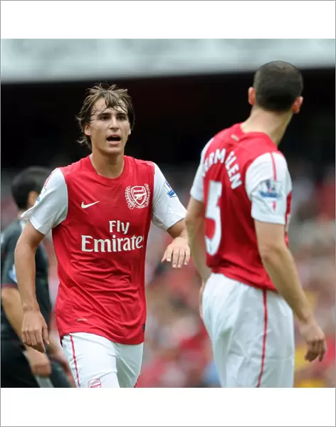 Ignasi Miquel and Thomas Vermaelen (Arsenal). Arsenal 0: 2 Liverpool. Barclays Premier League