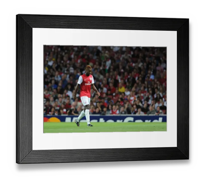 Framed Print : Arsenal's Johan Djourou Limps Off in UEFA Champions League Play-Off Against Udinese (2011-12) Framed Print : Arsenal's Johan Djourou Limps Off in UEFA Champions League Play-Off Against Udinese (2011-12)