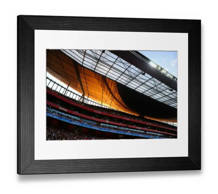Framed Print : Arsenal's Emirates Stadium: A Battle Against Udinese in the 2011-12 UEFA Champions League Play-Off