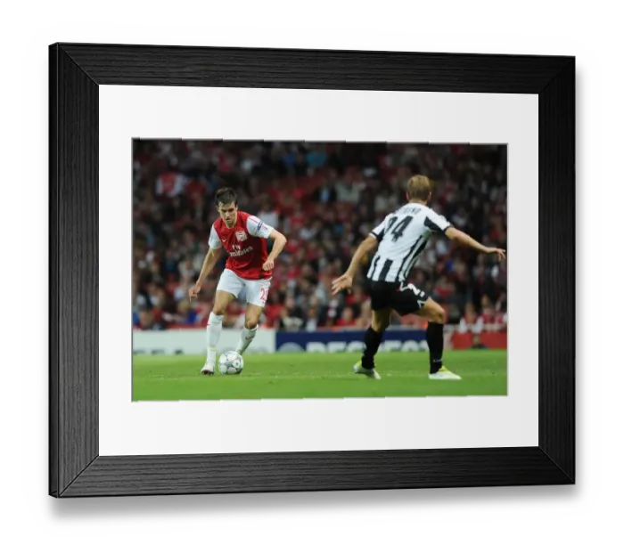 Framed Print : Arsenal's Carl Jenkinson Faces Off Against Udinese's Joel Ekstrand in 2011-12 UEFA Champions League Play-Off Framed Print : Arsenal's Carl Jenkinson Faces Off Against Udinese's Joel Ekstrand in 2011-12 UEFA Champions League Play-Off