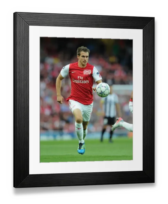 Framed Print : Arsenal's Aaron Ramsey in Action: Arsenal vs. Udinese, 2011-12 UEFA Champions League Play-Off Framed Print : Arsenal's Aaron Ramsey in Action: Arsenal vs. Udinese, 2011-12 UEFA Champions League Play-Off