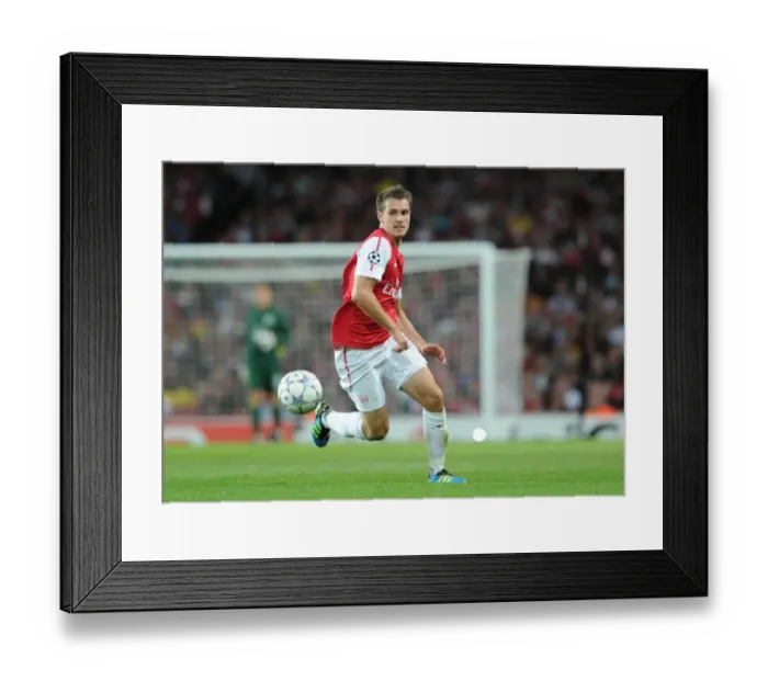 Framed Print : Arsenal's Aaron Ramsey in Action: Arsenal vs. Udinese, 2011-12 UEFA Champions League Play-Off
