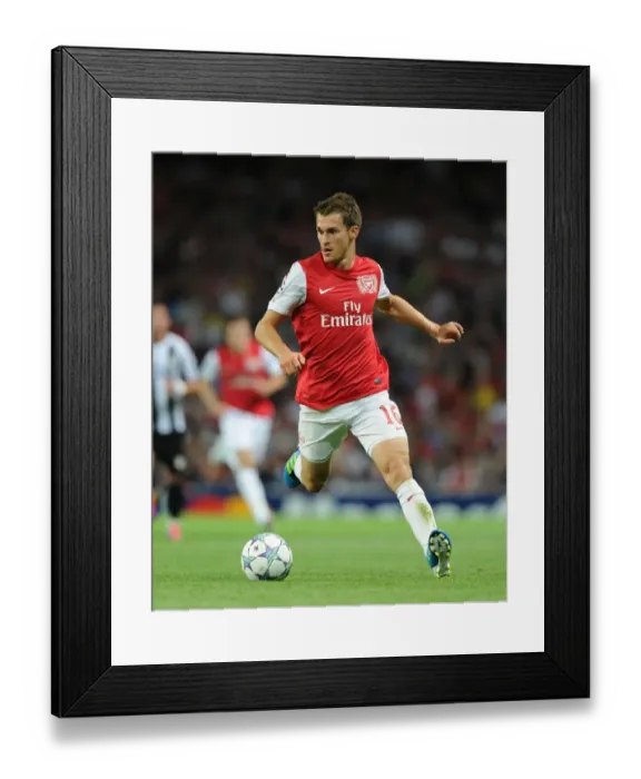 Framed Print : Aaron Ramsey: In Action for Arsenal against Udinese, UEFA Champions League Play-Off, 2011 Framed Print : Aaron Ramsey: In Action for Arsenal against Udinese, UEFA Champions League Play-Off, 2011