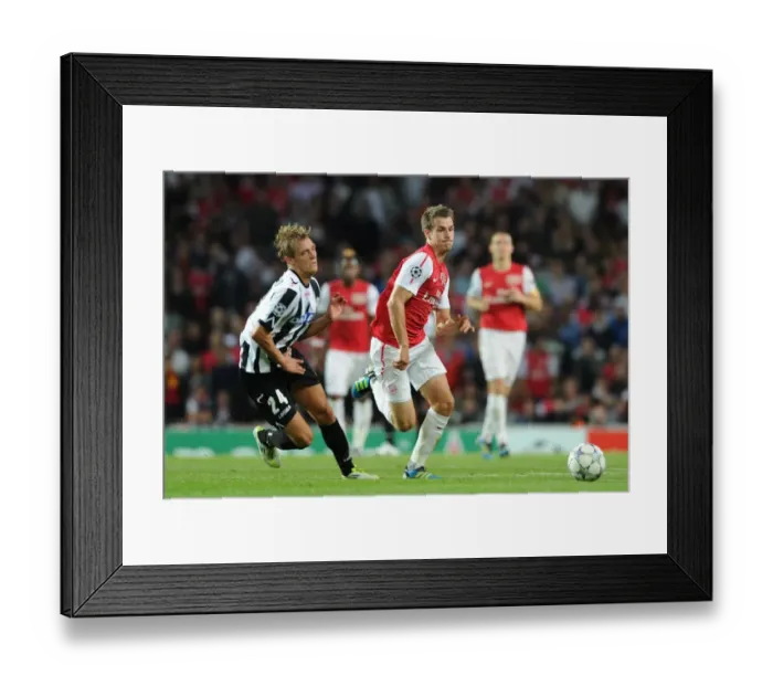 Framed Print : Aaron Ramsey vs Medhi Benatia: Clash of the Champions League Titans (2011)