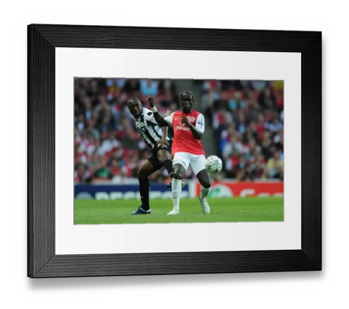Framed Print : Arsenal's Bacary Sagna Tackles Udinese's Pablo Armero in 2011-12 UEFA Champions League Play-Off Framed Print : Arsenal's Bacary Sagna Tackles Udinese's Pablo Armero in 2011-12 UEFA Champions League Play-Off