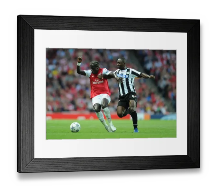 Framed Print : Battleground Emirates: Sagna Holds Off Armero in Arsenal's UEFA Champions League Clash (2011)