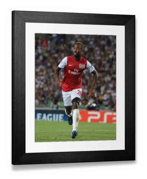 Framed Print : Johan Djourou in Action: Udinese vs. Arsenal, UEFA Champions League Play-Off 2011