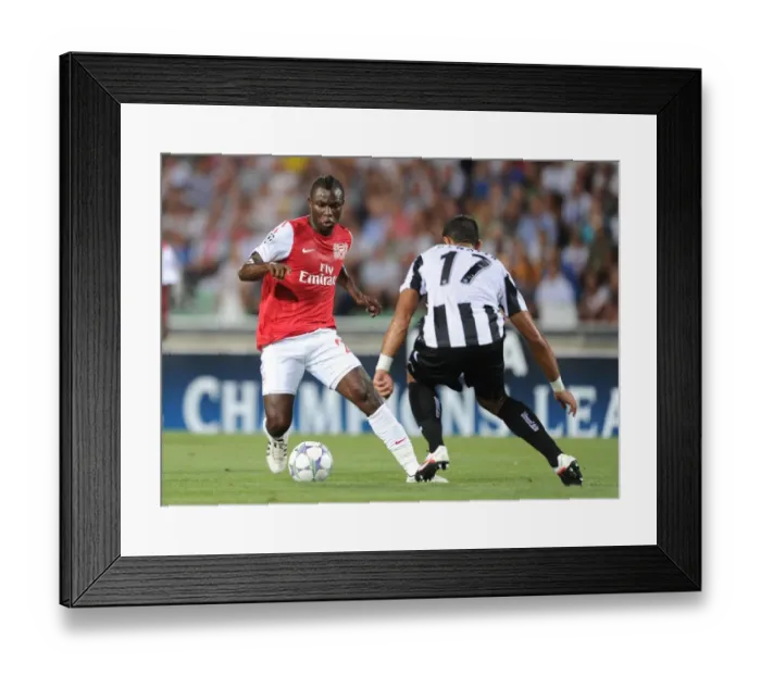 Framed Print : Emmanuel Frimpong vs Medhi Benatia: Battle in the UEFA Champions League Play-Offs (Udinese v Arsenal, 2011)