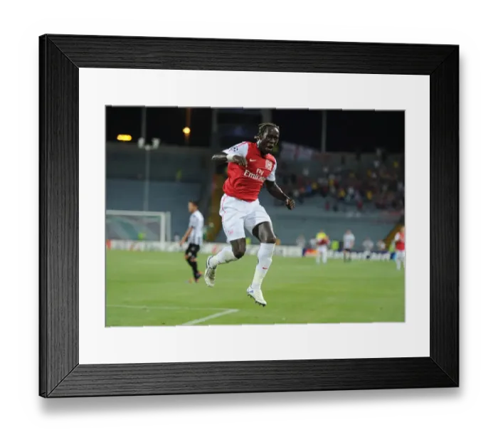 Framed Print : Bacary Sagna's Celebration: Arsenal's Winning Moment Against Udinese in 2011 Champions League Play-Off
