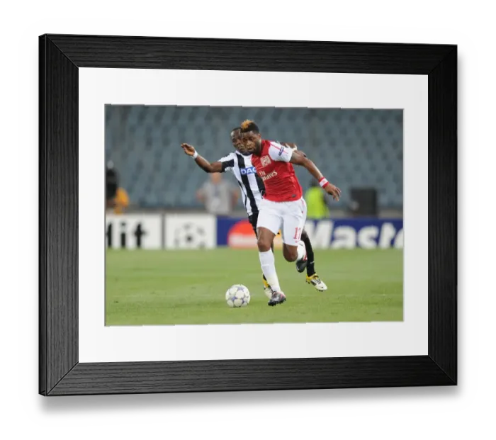 Framed Print : Arsenal's Alex Song Overpowers Udinese's Emmanuel Badu in UEFA Champions League Clash (Udinese v Arsenal 2011-12) Framed Print : Arsenal's Alex Song Overpowers Udinese's Emmanuel Badu in UEFA Champions League Clash (Udinese v Arsenal 2011-12)