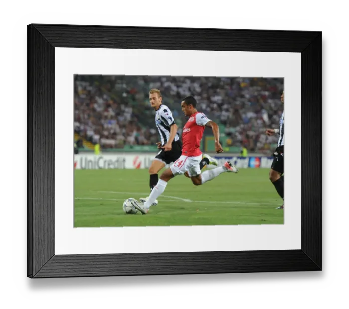 Framed Print : Theo Walcott's Strike: Arsenal's Winning Moment against Udinese in the UEFA Champions League Play-Off (2011) Framed Print : Theo Walcott's Strike: Arsenal's Winning Moment against Udinese in the UEFA Champions League Play-Off (2011)