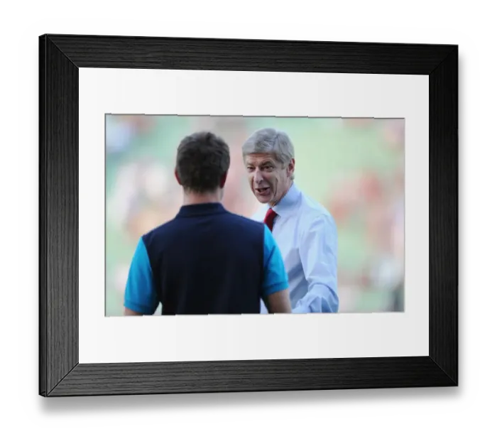 Framed Print : Arsene Wenger's Light-Hearted Moment with Aaron Ramsey during Udinese v Arsenal, UEFA Champions League Play-Off (2011)