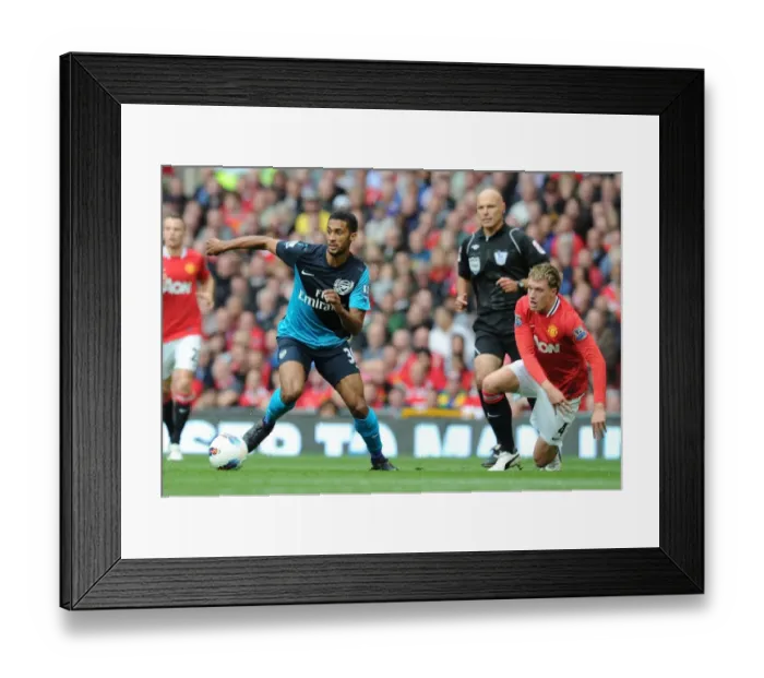 Framed Print : Armand Traore vs. Phil Jones: A Premier League Battle at Old Trafford (2011-12)
