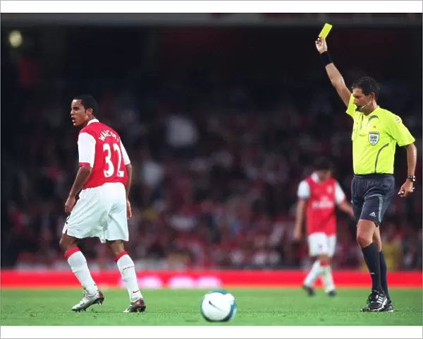 Theo Walcott (Arsenal) is shown the Yellow card by the referee