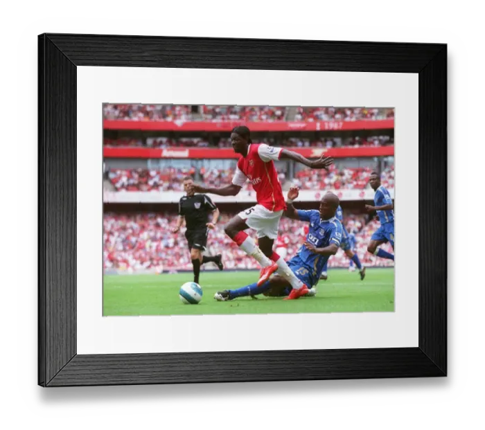 Framed Print : Adebayor's Brace: Arsenal Overpowers Distin and Portsmouth 3-1 in Premier League