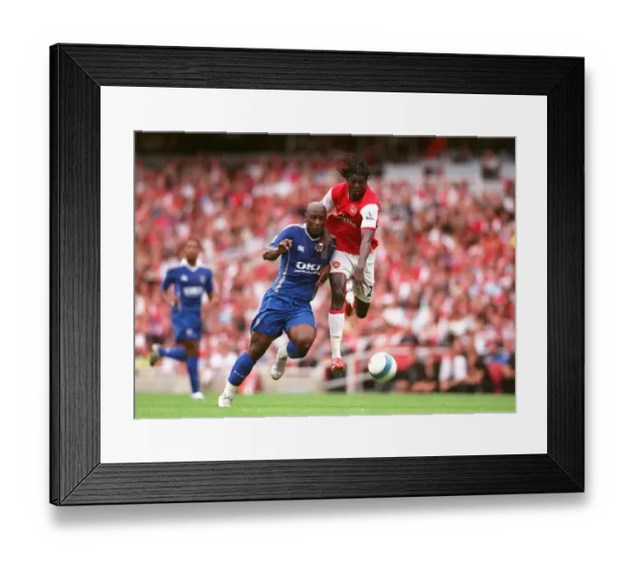Framed Print : Arsenal's Adebayor Scores Twice in 3:1 Victory over Pamarot's Portsmouth in Barclays Premier League Framed Print : Arsenal's Adebayor Scores Twice in 3:1 Victory over Pamarot's Portsmouth in Barclays Premier League
