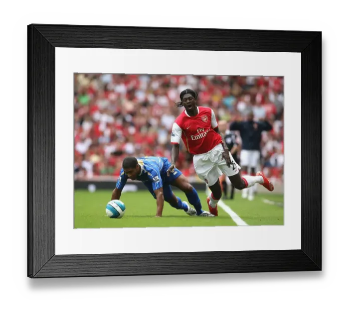 Framed Print : Adebayor's Brace: Arsenal Triumphs 3-1 over Portsmouth