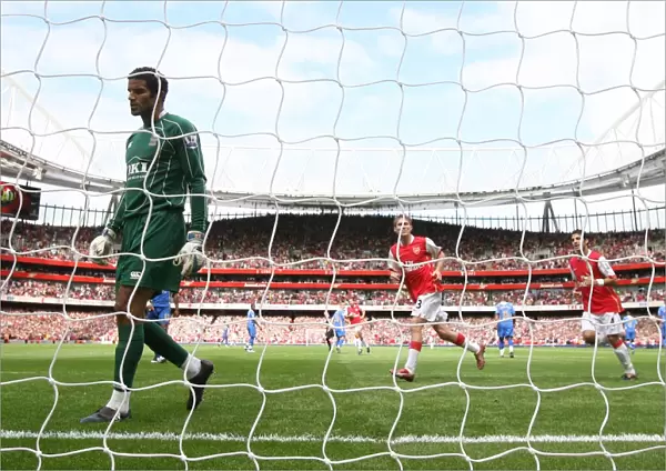 Alex Hleb and Cesc Fabregas celebrate the 1st Arsenal goal scored by Emmanuel Adebayor