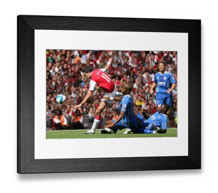 Framed Print : Robin van Persie (Arsenal) Sylvian Distan and Sulley Muntari (Portsmouth) Framed Print : Robin van Persie (Arsenal) Sylvian Distan and Sulley Muntari (Portsmouth)
